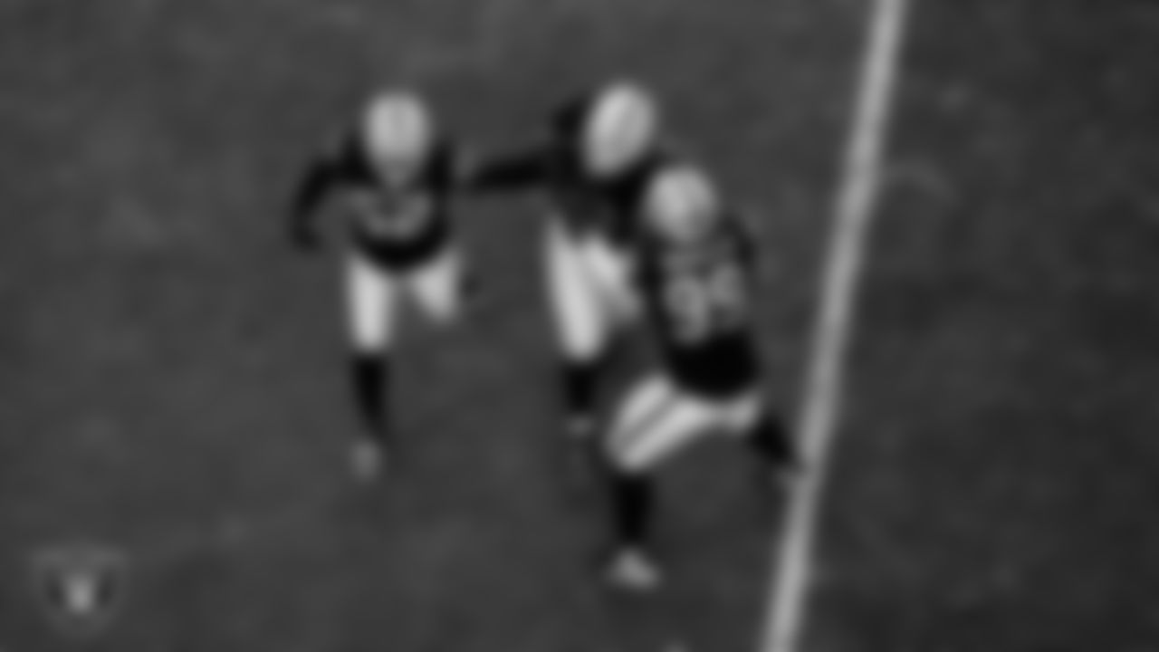 Las Vegas Raiders linebacker Elandon Roberts (52), defensive tackle JJ Pegues (92) and defensive tackle Thomas Booker IV (99) during the regular season home game against the Kansas City Chiefs at Allegiant Stadium.