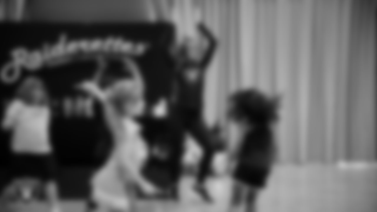 Raiderette Shelby with dancers during day one of summer camp at The Studio.