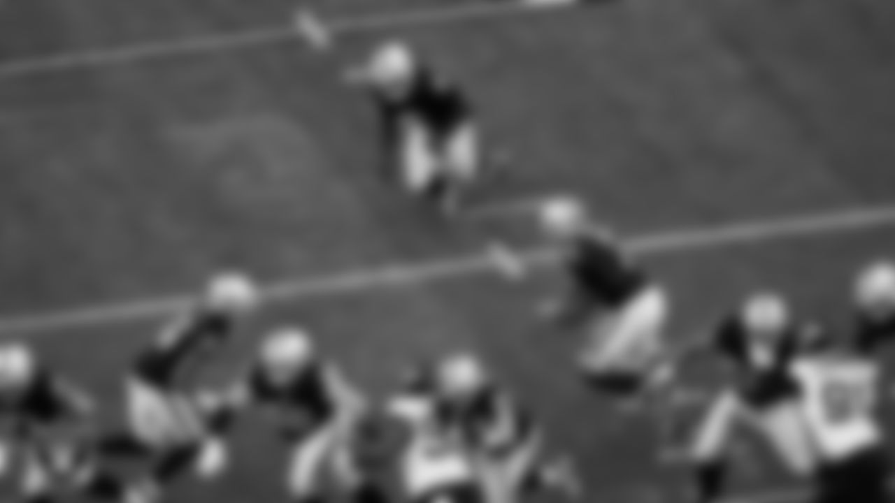 Las Vegas Raiders quarterback Geno Smith (7) looks to hand off the ball during the regular season home game against the Jacksonville Jaguars at Allegiant Stadium.
