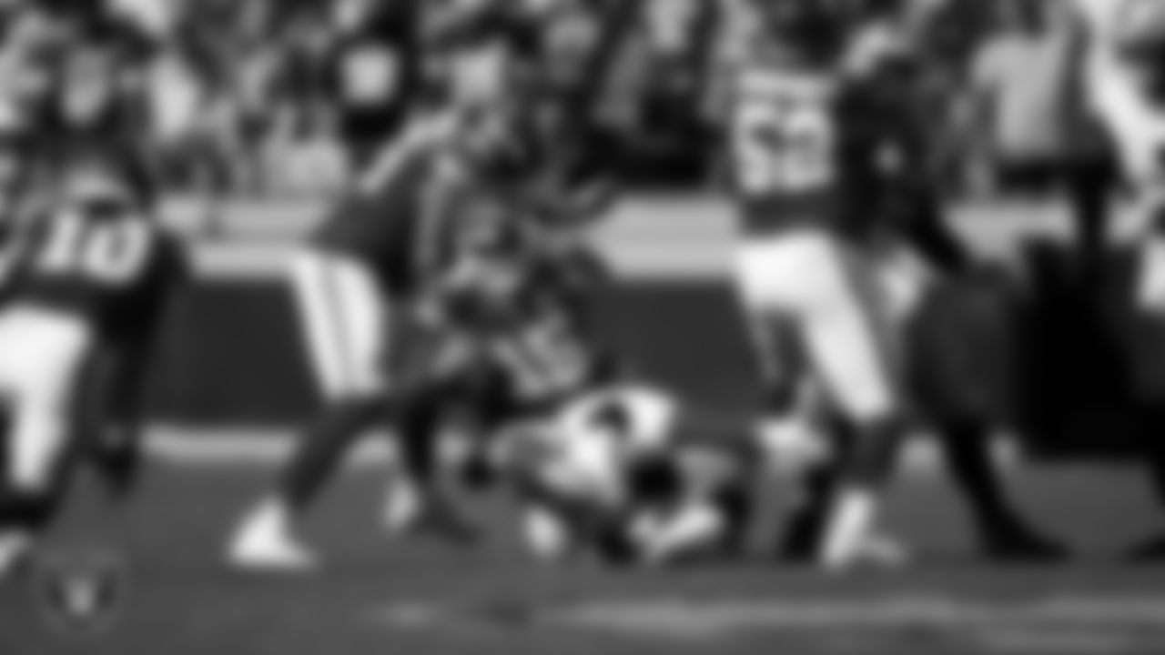 Las Vegas Raiders linebacker Jamal Adams (33) sacks the quarterback during the regular season away game against the Kansas City Chiefs at GEHA Field at Arrowhead Stadium.