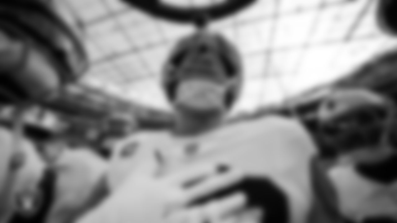 Las Vegas Raiders defensive end Maxx Crosby (98) in a huddle before the regular season away game against the Los Angeles Chargers at SoFi Stadium.