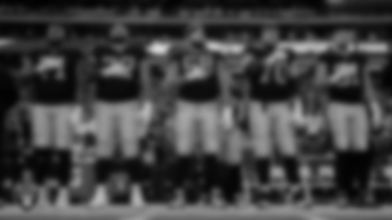 Las Vegas Raiders tackle Justin Herron (71), guard/tackle Jermaine Eluemunor (72), center Andre James (68), guard Greg Van Roten (70) and tight end Austin Hooper (81) during the national anthem before the regular season home game against the New York Giants at Allegiant Stadium.