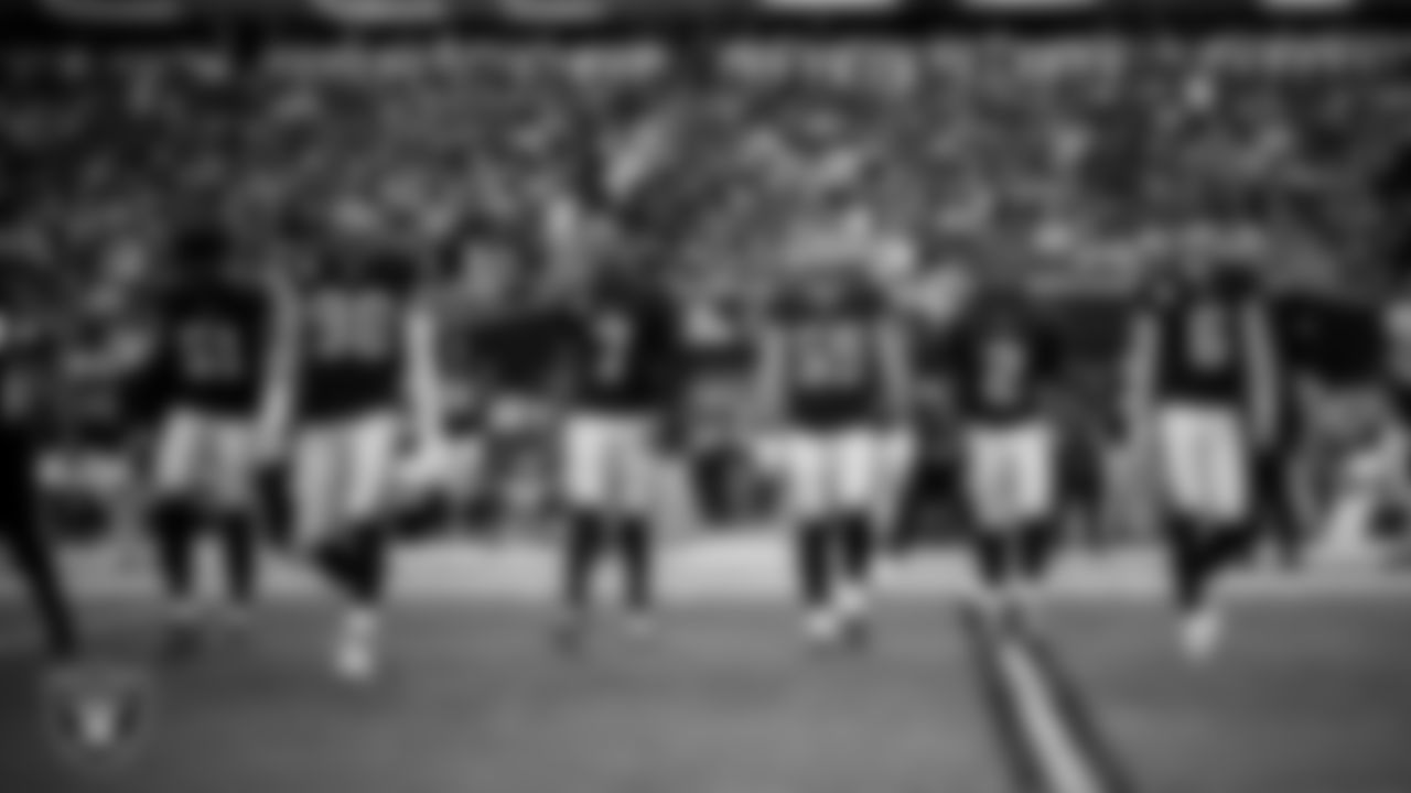 The Las Vegas Raiders walk out to the center of the field for the coin toss before the regular season home game against the the Jacksonville Jaguars at Allegiant Stadium.