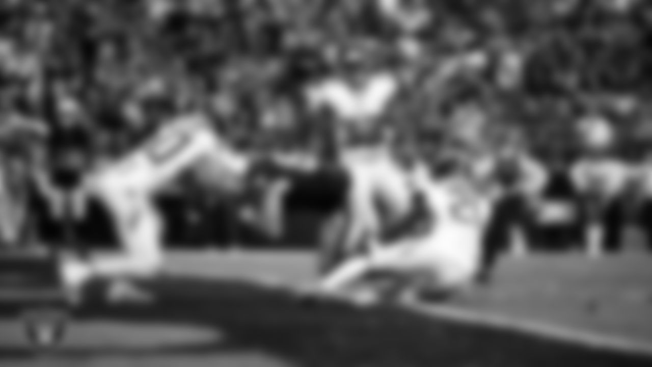Las Vegas Raiders tight end Michael Mayer (87) dives into the end zone after making a 4-yard touchdown catch during the regular season home game against the Tennessee Titans at Allegiant Stadium.