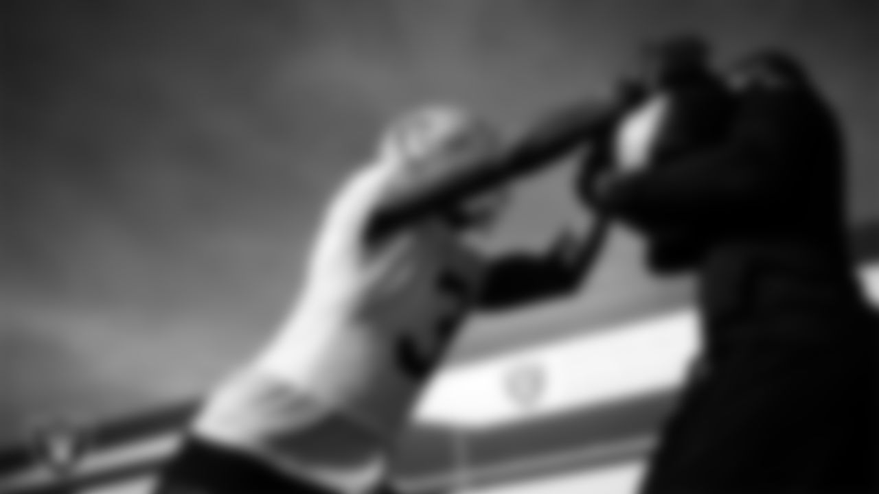 Las Vegas Raiders running back Zamir White (3) and running backs coach Deland McCullough during practice at Intermountain Health Performance Center.