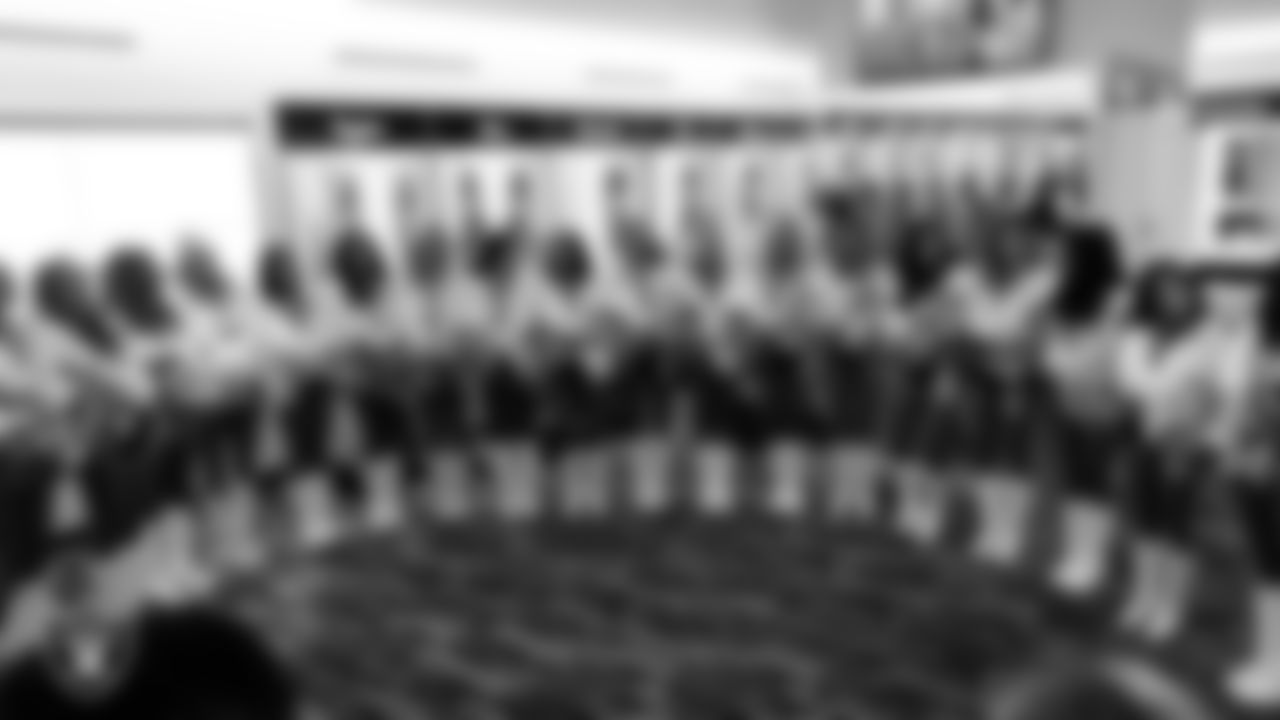 The Raiderettes huddle in the locker room before the regular season home game against the Cleveland Browns at Allegiant Stadium.