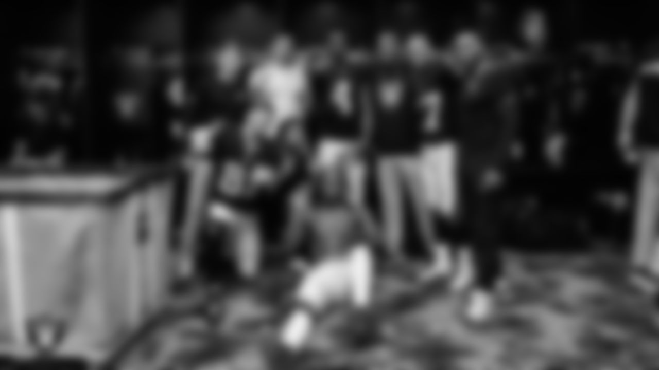 Las Vegas Raiders offensive quality control coach Conner McQueen, wide receivers coach Chris Beatty and the wide receivers in the locker room after the regular season home game against the Kansas City Chiefs at Allegiant Stadium.