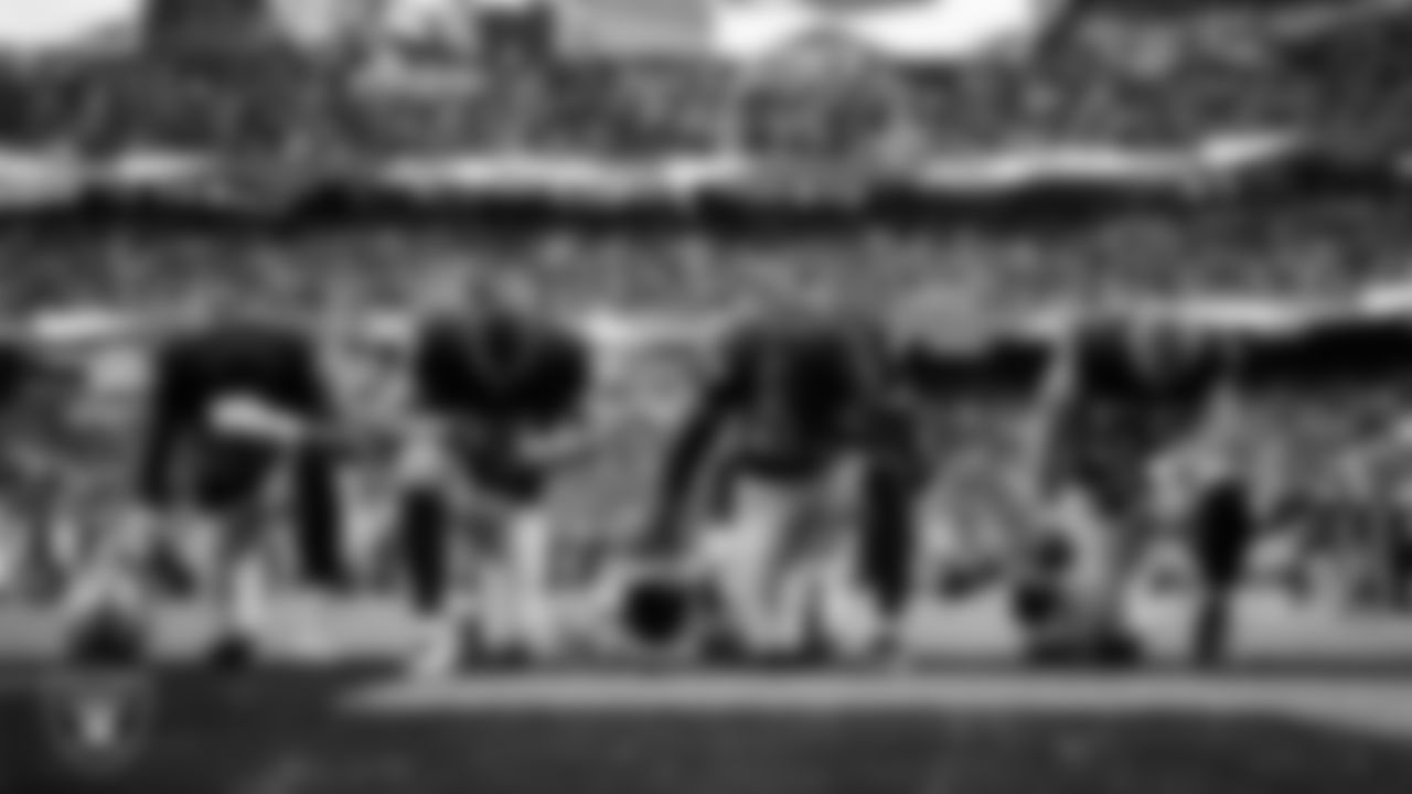 Las Vegas Raiders wide receiver Justin Shorter (88), wide receiver Jack Bech (18), safety Tristin McCollum (27) and linebacker Cody Lindenberg (55) during the national anthem before the regular season home game against the Tennessee Titans at Allegiant Stadium.