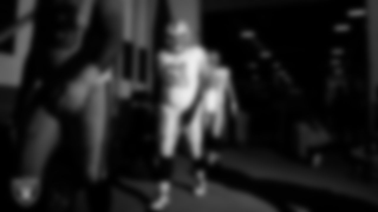 Las Vegas Raiders center/guard Jordan Meredith (61) walks down the tunnel before the regular season away game against the Denver Broncos at Empower Field at Mile High.