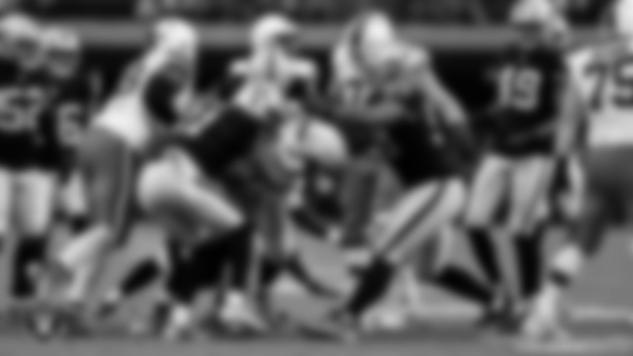 Las Vegas Raiders safety Jeremy Chinn (11), defensive tackle Adam Butler (69) and defensive tackle Thomas Booker IV (99) during the regular season home game against the Cleveland Browns at Allegiant Stadium.