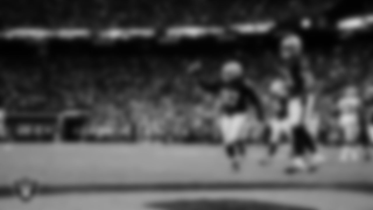 Las Vegas Raiders defensive tackle Tonka Hemingway (97) recovers a fumble during the regular season home game against the Dallas Cowboys at Allegiant Stadium.