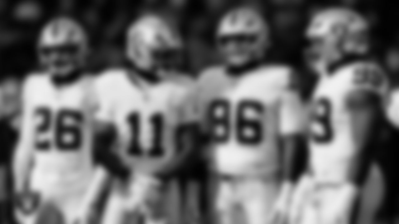 Las Vegas Raiders cornerback Darien Porter (26), safety Jeremy Chinn (11), defensive tackle Jonah Laulu (96) and defensive tackle Thomas Booker IV (99) during the regular season away game against the Philadelphia Eagles at Lincoln Financial Field.