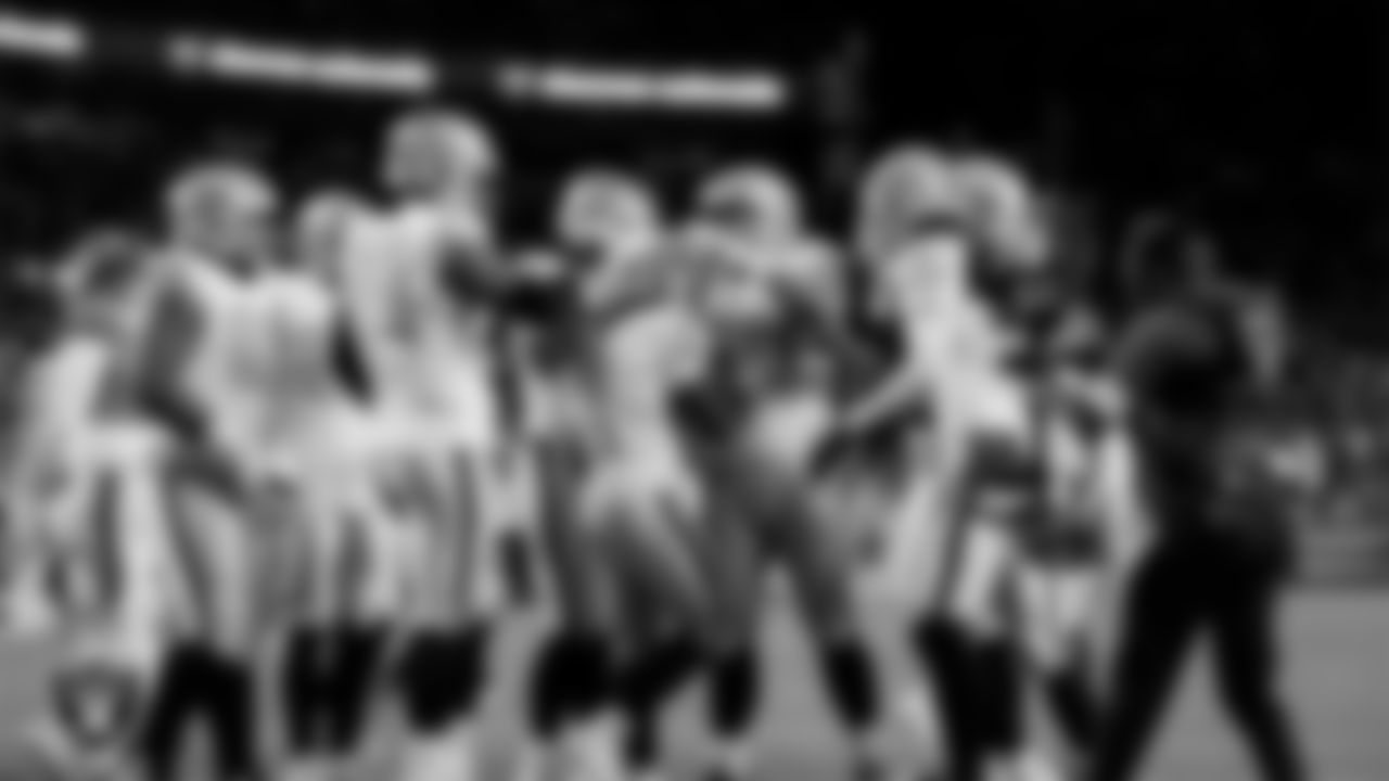 Las Vegas Raiders running back Ashton Jeanty (2) celebrates with teammates after rushing for a 4-yard touchdown during the regular season away game against the Denver Broncos at Empower Field at Mile High.