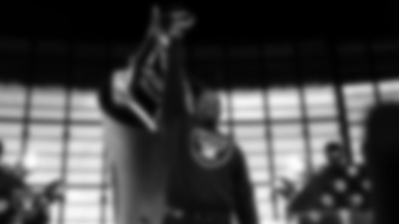 Las Vegas Raiders alumnus Napoleon Kaufman lights the Al Davis Memorial Torch before the Las Vegas Raiders' regular season home game against the Denver Broncos at Allegiant Stadium.