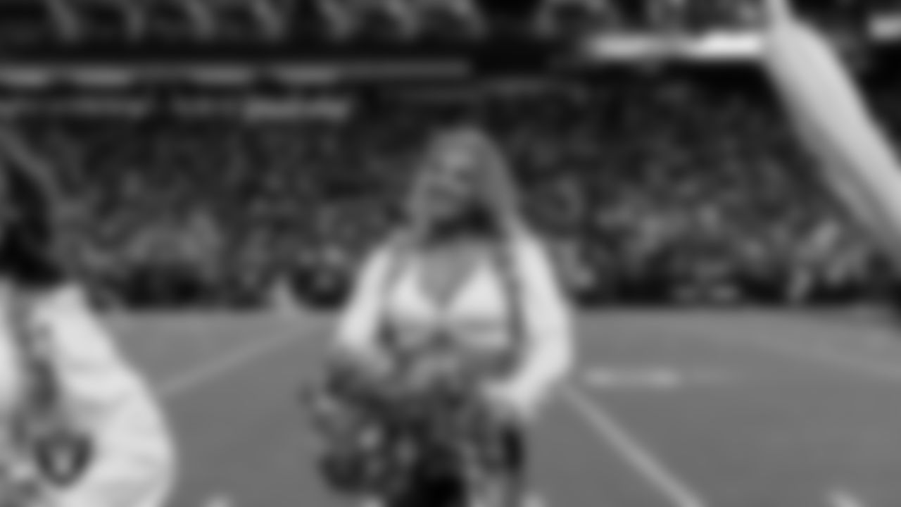Raiderette Cori on the sidelines during the regular season home game against the Dallas Cowboys at Allegiant Stadium.
