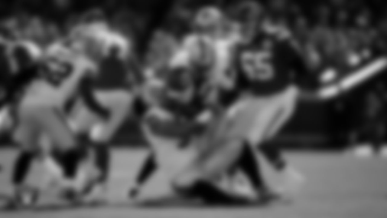 Las Vegas Raiders defensive tackle Leki Fotu (95) and defensive end Malcolm Koonce (51) make a tackle during the regular season away game against the Kansas City Chiefs at GEHA Field at Arrowhead Stadium.