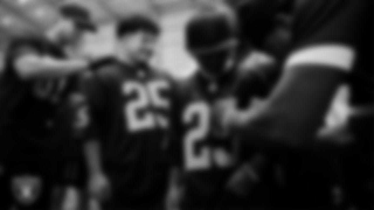 Marcos Carrillo and Christopher Arias from Make-A-Wish get their jerseys signed after practice during a visit to Intermountain Health Performance Center.