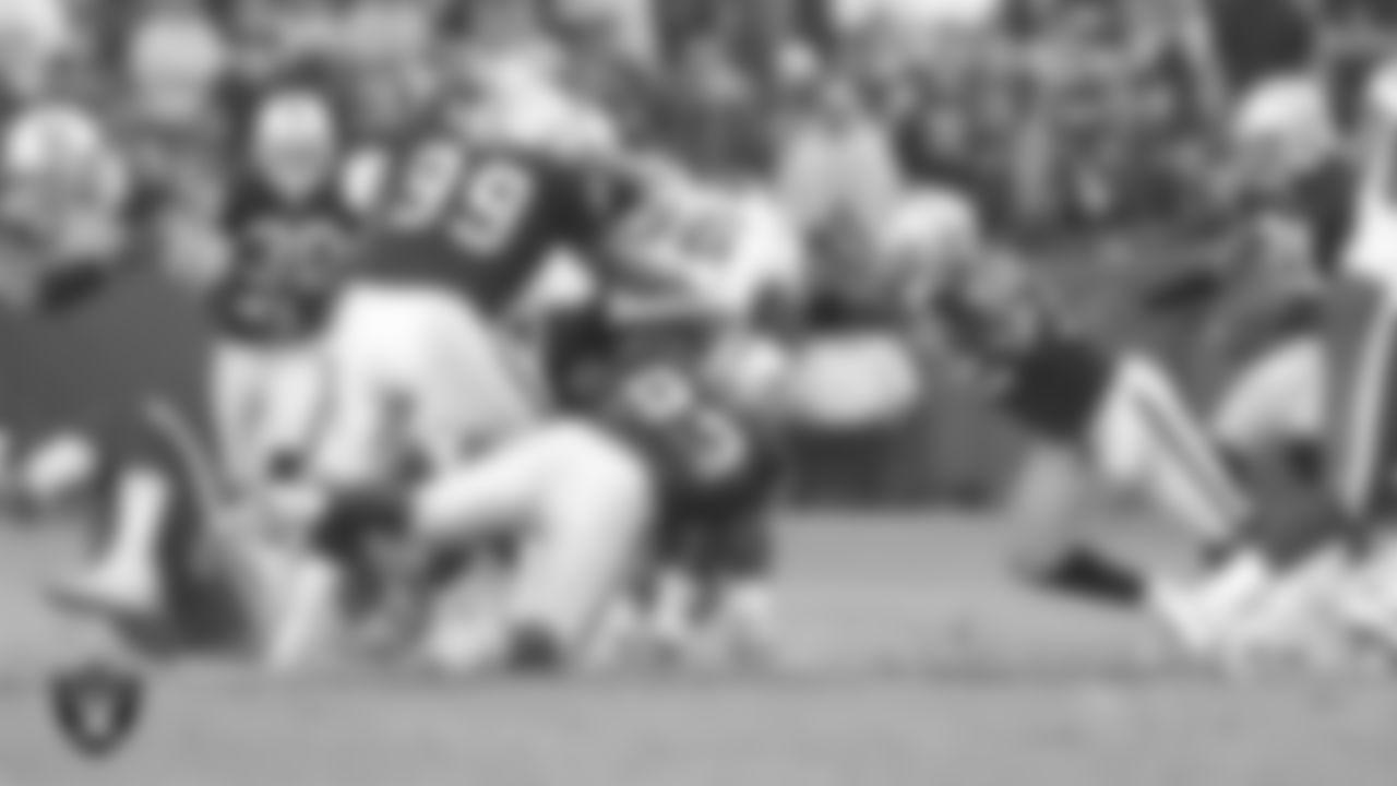 Oakland Raiders defensive tackle Warren Sapp (99), defensive tackle Tommy Kelly (93) and linebacker Kirk Morrison (52) during the regular season home game against the Houston Texans at McAfee Coliseum, Sunday, December 3, 2006, in Oakland, Calif.
