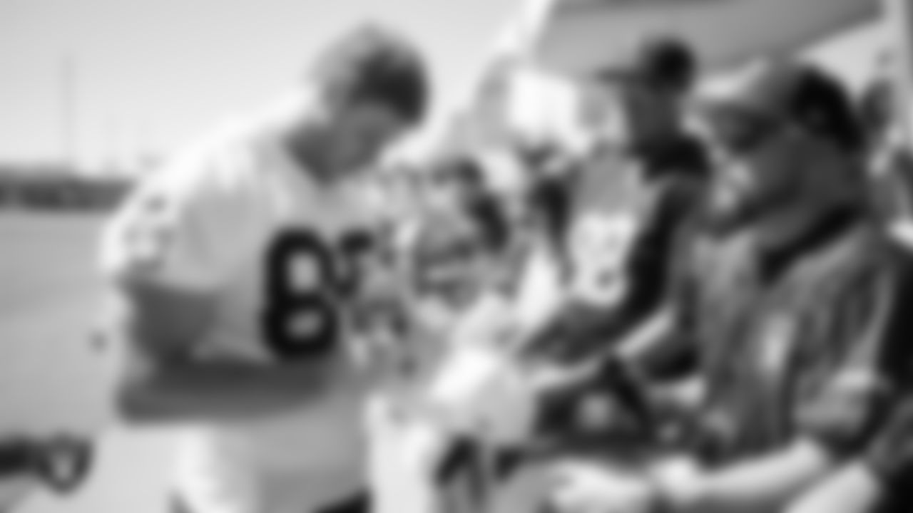 Las Vegas Raiders tight end Pat Conroy (86) signs autographs after a 2025 Training Camp practice at Intermountain Health Performance Center.