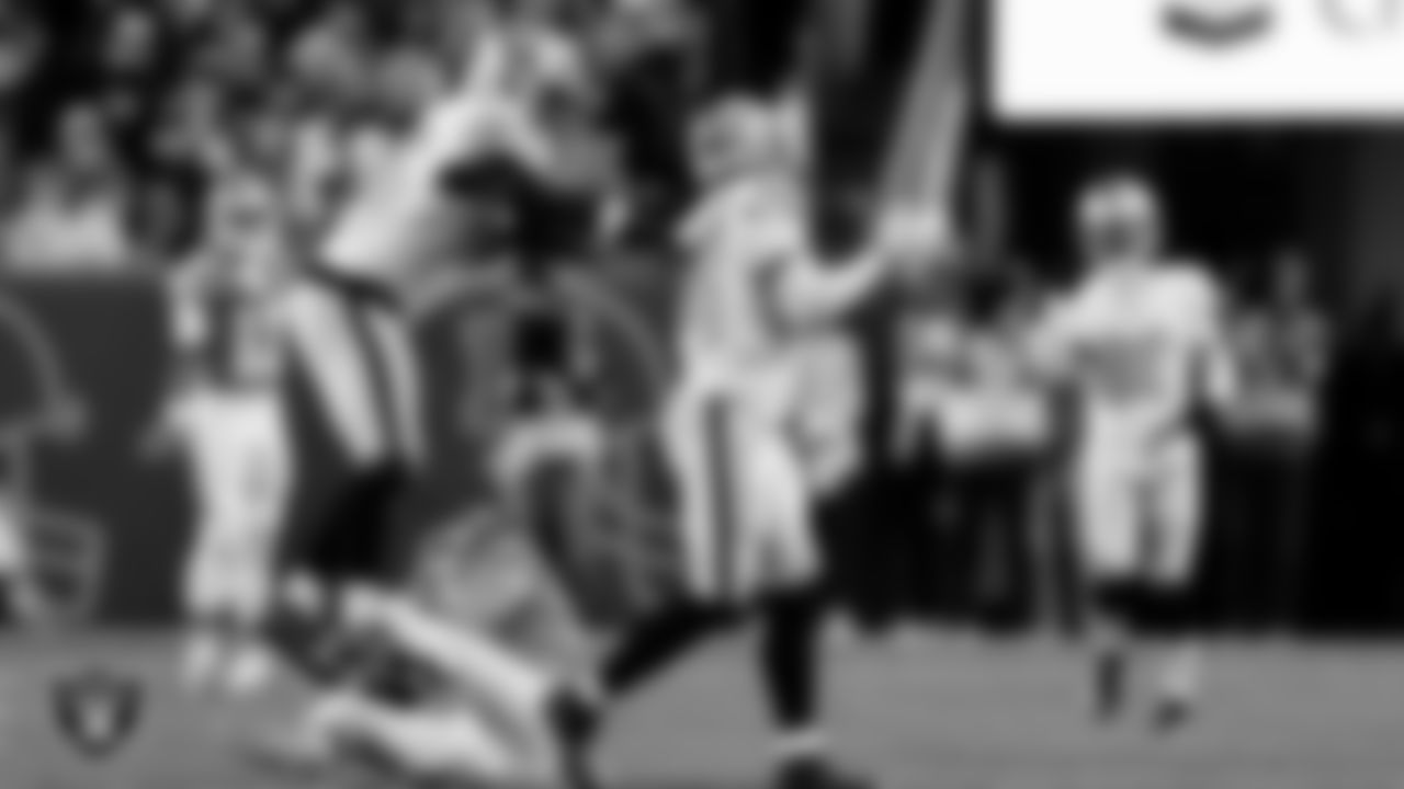 Las Vegas Raiders linebacker Devin White (45) and safety Lonnie Johnson Jr. (32) during the regular season away game against the Denver Broncos at Empower Field at Mile High.