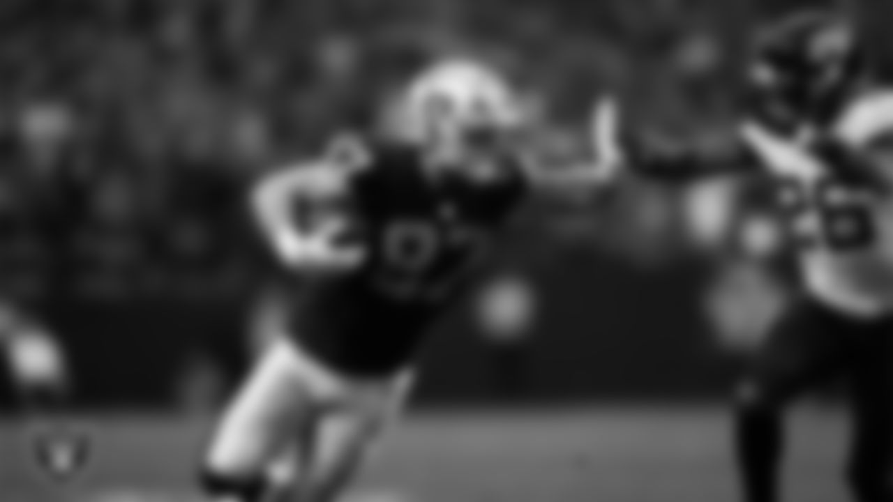 Las Vegas Raiders tight end Michael Mayer (87) stiff arms the defender during the regular season home game against the Jacksonville Jaguars at Allegiant Stadium.