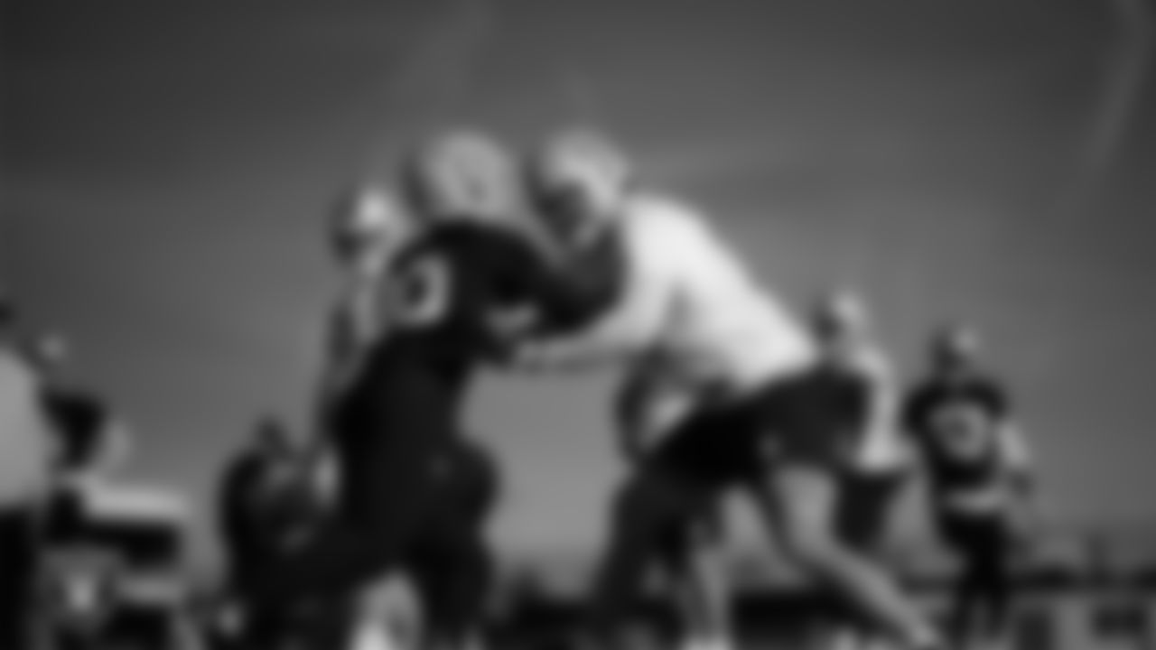 Las Vegas Raiders defensive end Ovie Oghoufo (90) and tackle Dalton Wagner (78) during practice at Intermountain Health Performance Center.