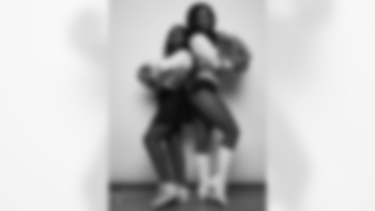 Raiderette Cierra poses for a photo with a Junior Raiderette during 2025 Media Day at The Studio.