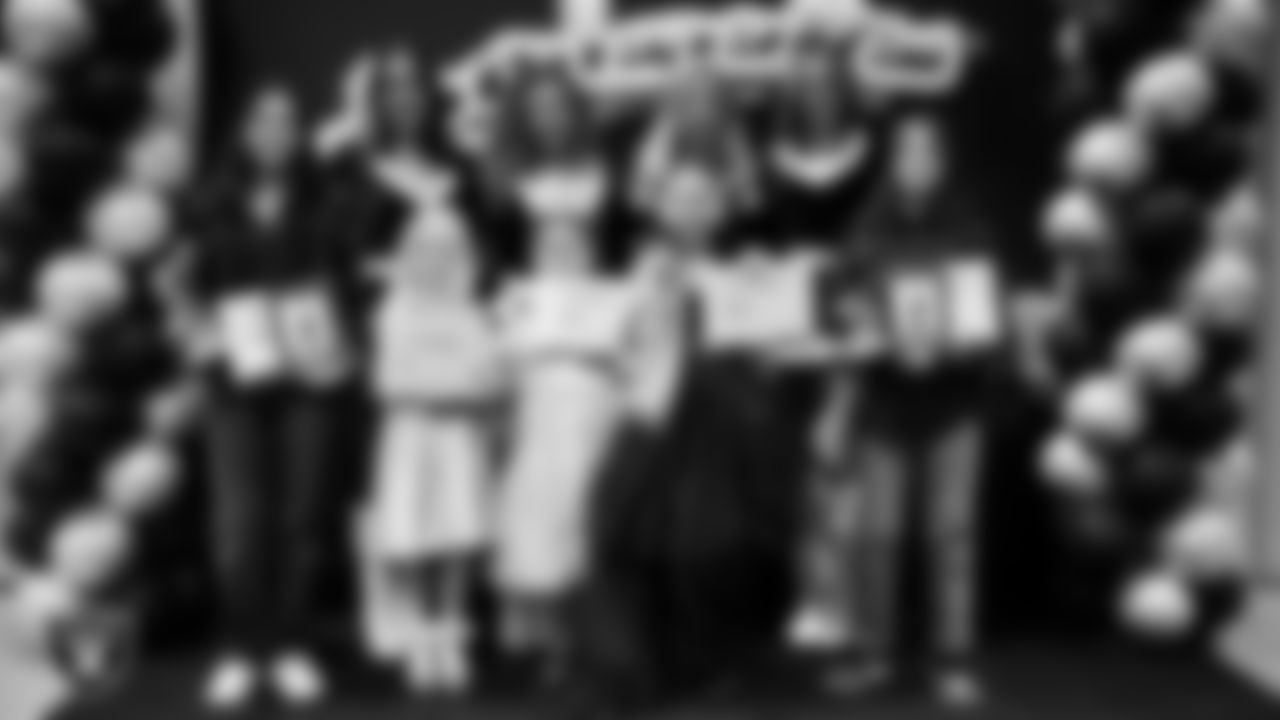 Raiderettes pose for a photo with Junior Raiderettes during the Junior Raiderettes Banquet at The Studio.