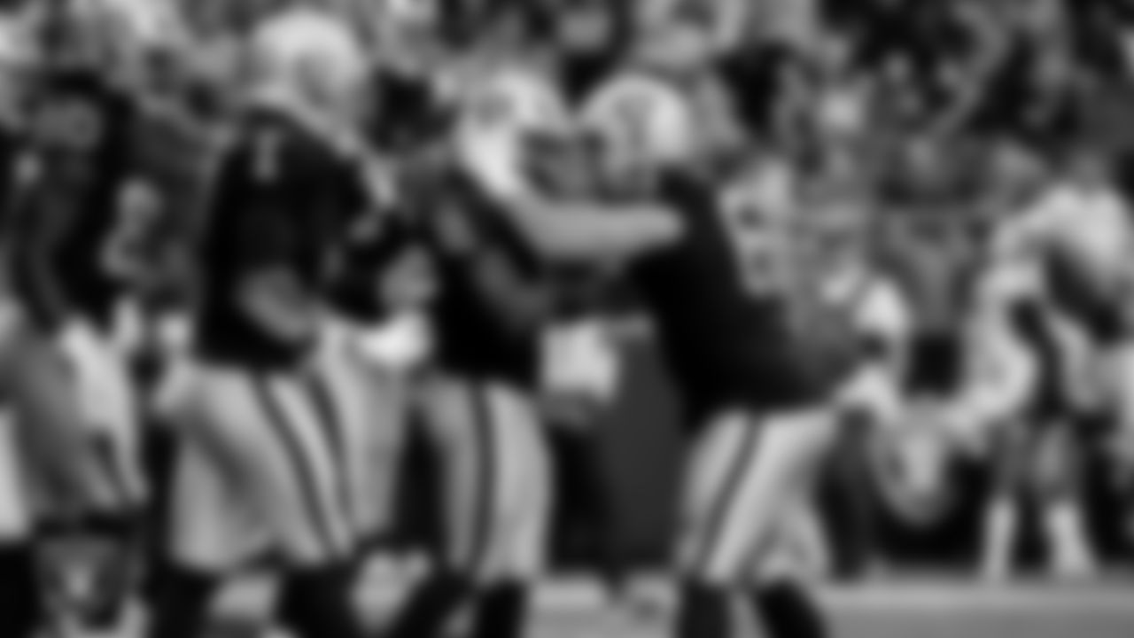 Las Vegas Raiders running back Ashton Jeanty (2) celebrates with center/guard Jordan Meredith (61) after rushing for a 3-yard touchdown during the regular season home game against the Tennessee Titans at Allegiant Stadium.