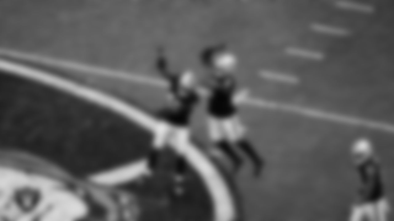 Las Vegas Raiders defensive end Tyree Wilson (9) celebrates with linebacker Devin White (45) after sacking the quarterback during the regular season home game against the Chicago Bears at Allegiant Stadium.