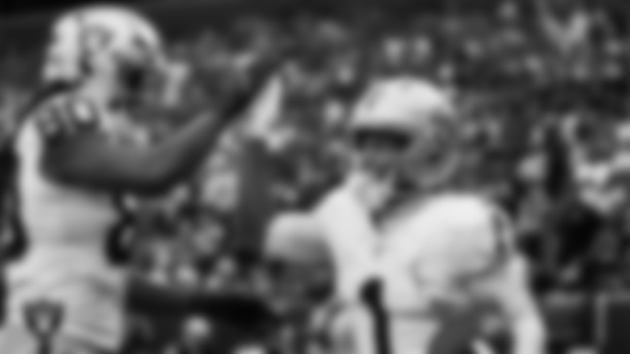 Las Vegas Raiders wide receiver Tre Tucker (1) celebrates with tight end Ian Thomas (80) after making a 10-yard touchdown catch during the regular season away game against the Washington Commanders at Northwest Stadium.