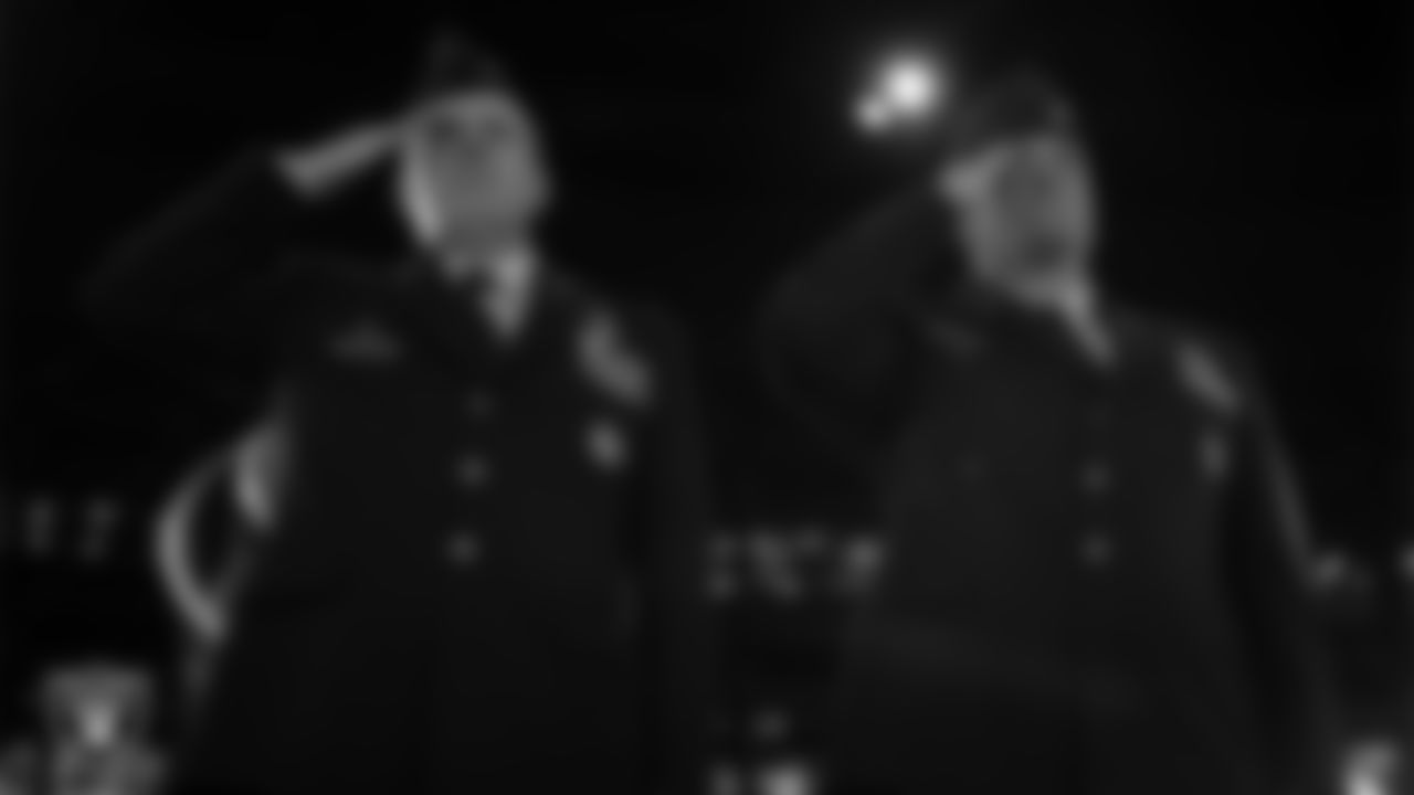 Nellis Air Force Airmen Colonel Jason J. Glunn and Colonel Ethan E. Sabin during the national anthem before the regular season home game against the Dallas Cowboys at Allegiant Stadium.