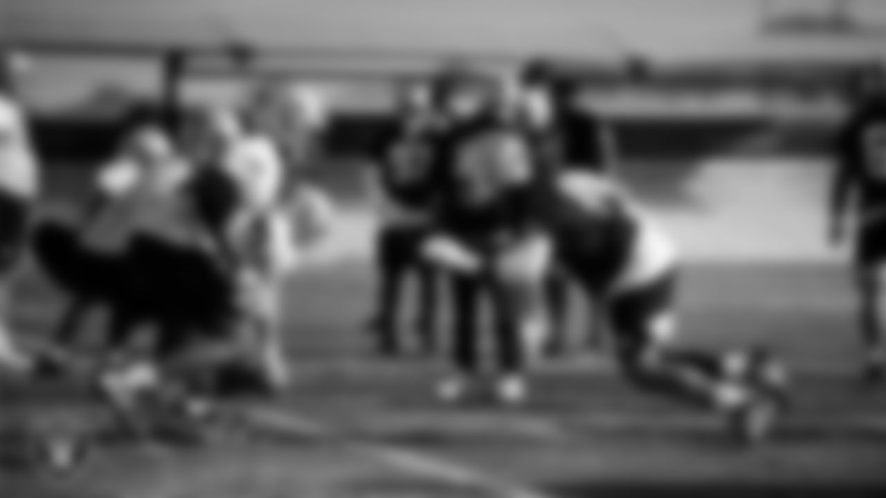 Las Vegas Raiders tackle Charles Grant (60) and defensive tackle Jonah Laulu (96) during practice at Intermountain Health Performance Center.