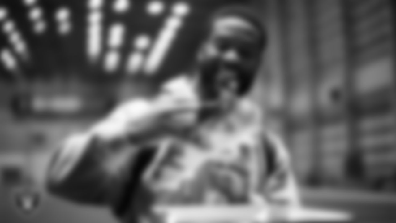 Las Vegas Raiders safety Jeremy Chinn (11) unboxes his custom cleats for the NFL's My Cause My Cleats initiative at Intermountain Health Performance Center.