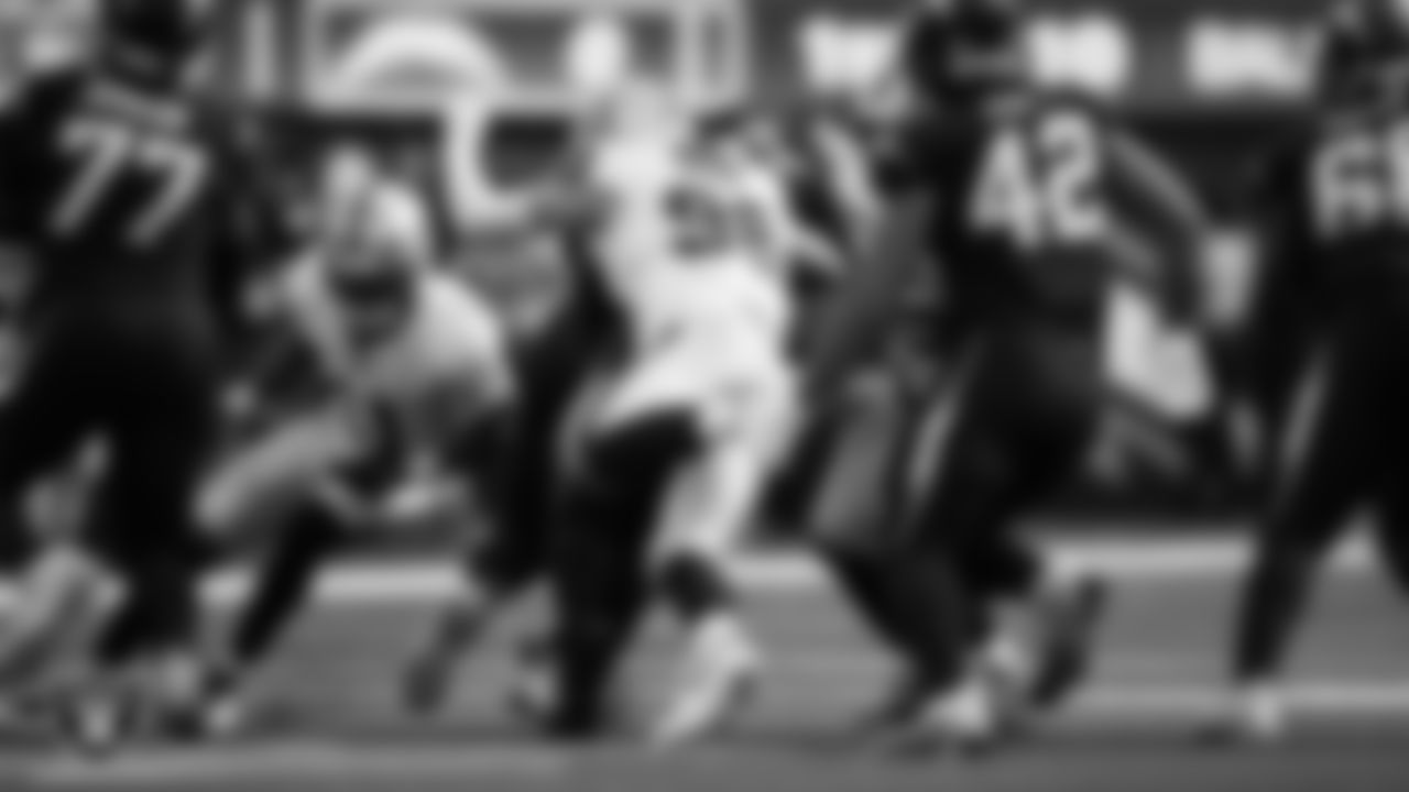 Las Vegas Raiders defensive end Maxx Crosby (98) makes a tackle during the regular season away game against the Los Angeles Chargers at SoFi Stadium.