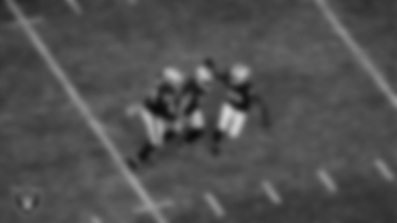 Las Vegas Raiders linebacker Robert Spillane (41) celebrates with linebacker Malik Reed (52) and cornerback Nate Hobbs (39) after making a tackle during the regular season home game against the New York Jets at Allegiant Stadium.