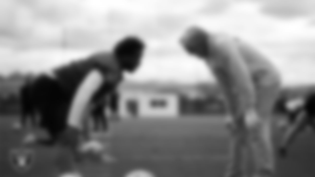 Las Vegas Raiders quarterback Geno Smith (7) and Head Coach Pete Carroll during practice at Intermountain Health Performance Center.