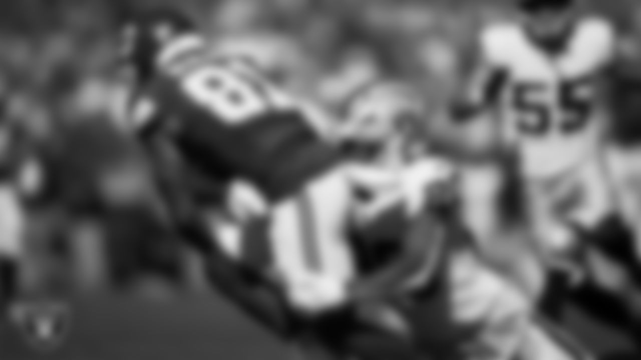 Las Vegas Raiders safety Isaiah Pola-Mao (20) makes a tackle during the regular season away game against the Kansas City Chiefs at GEHA Field at Arrowhead Stadium.