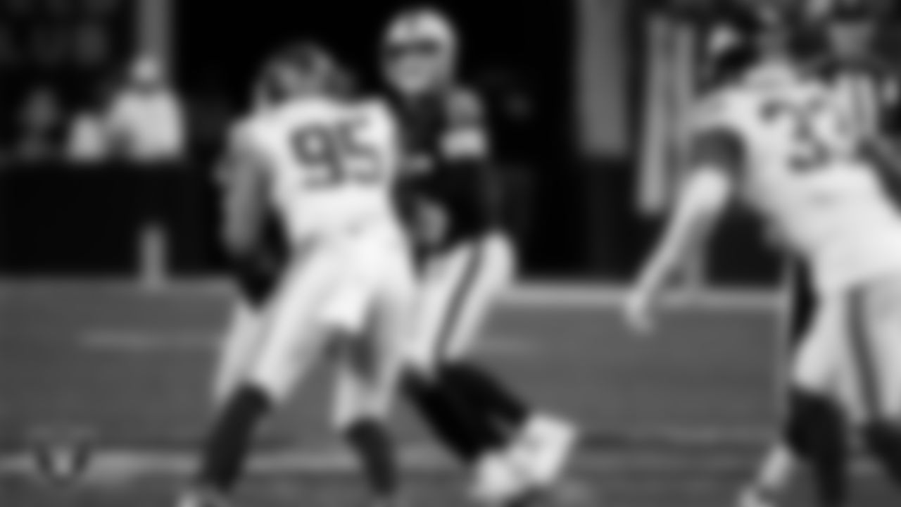 Las Vegas Raiders quarterback Kenny Pickett (15) looks for a receiver during the regular season home game against the New York Giants at Allegiant Stadium.