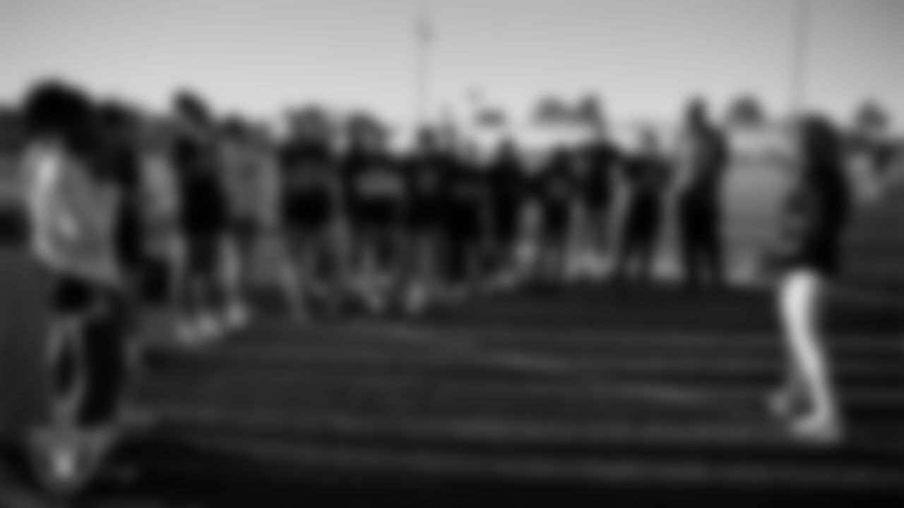 Las Vegas Raiders manager of football development Marli Bartlett talks to the Green Valley High School flag football team during practice at Green Valley High School.