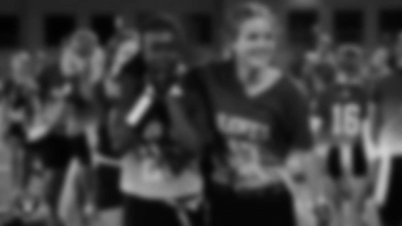 Members of the Charles Arthur Hughes Middle School girls flag football team celebrate after winning a 2025 Middle School Flag Football Championship game at All American Park.