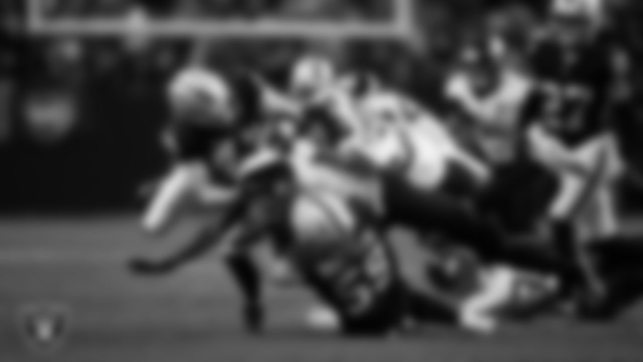 Las Vegas Raiders linebacker Tommy Eichenberg (44) and linebacker Jon Rhattigan (59) make a tackle during the regular season home game against the Jacksonville Jaguars at Allegiant Stadium.