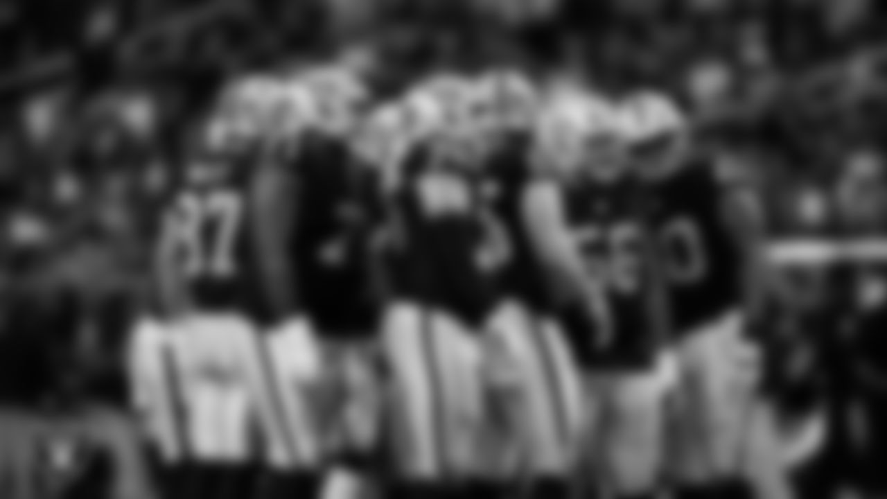 The Las Vegas Raiders offense huddles during the regular season home game against the Kansas City Chiefs at Allegiant Stadium.