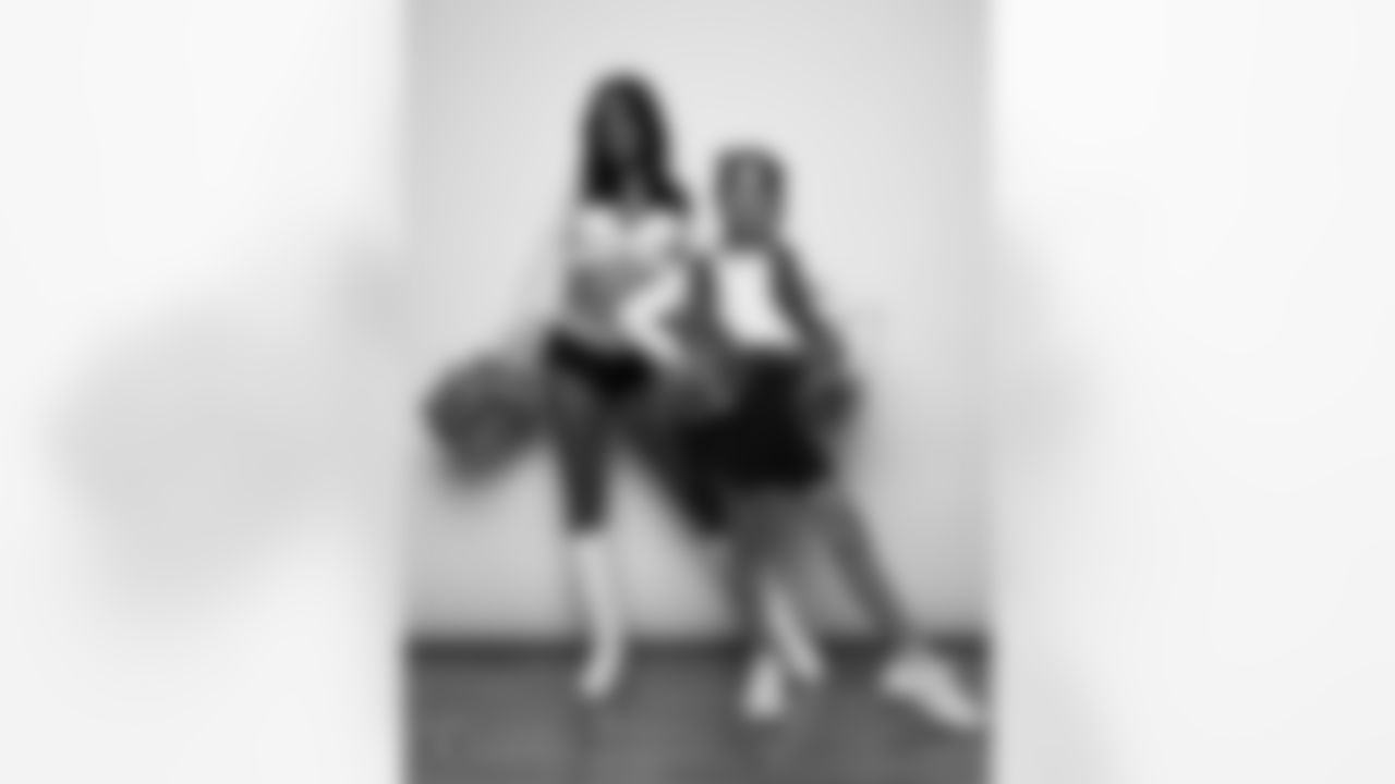 Raiderette Reagan poses for a photo with a Junior Raiderette during 2025 Media Day at The Studio.