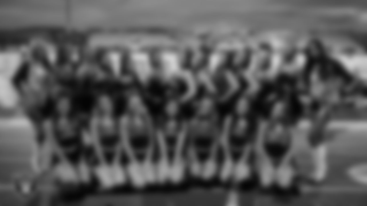 Raiderettes Jessica and Meekela pose for a photo with the 
Coronado High School dance team before the Las Vegas Raiders' Football Showcase game at Coronado High School.