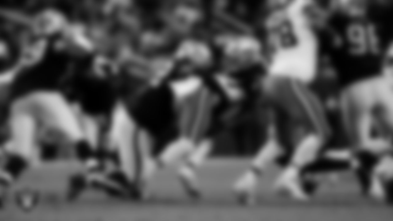 Las Vegas Raiders defensive tackle JJ Pegues (92) and defensive end Charles Snowden (49) during the regular season home game against the Cleveland Browns at Allegiant Stadium.