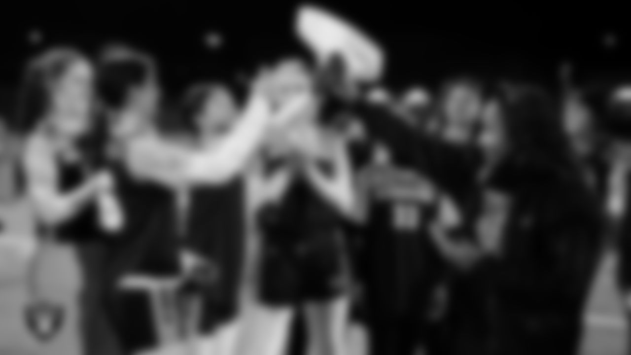 Las Vegas Raiders manager of football development Marli Bartlett presents the championship belt the Raiders' High School Flag Football Showcase game at Bonanza High School.