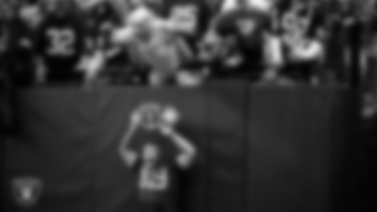 WWE professional wrestler Rey Mysterio with fans before the Las Vegas Raiders' regular season home game against the Pittsburgh Steelers at Allegiant Stadium.