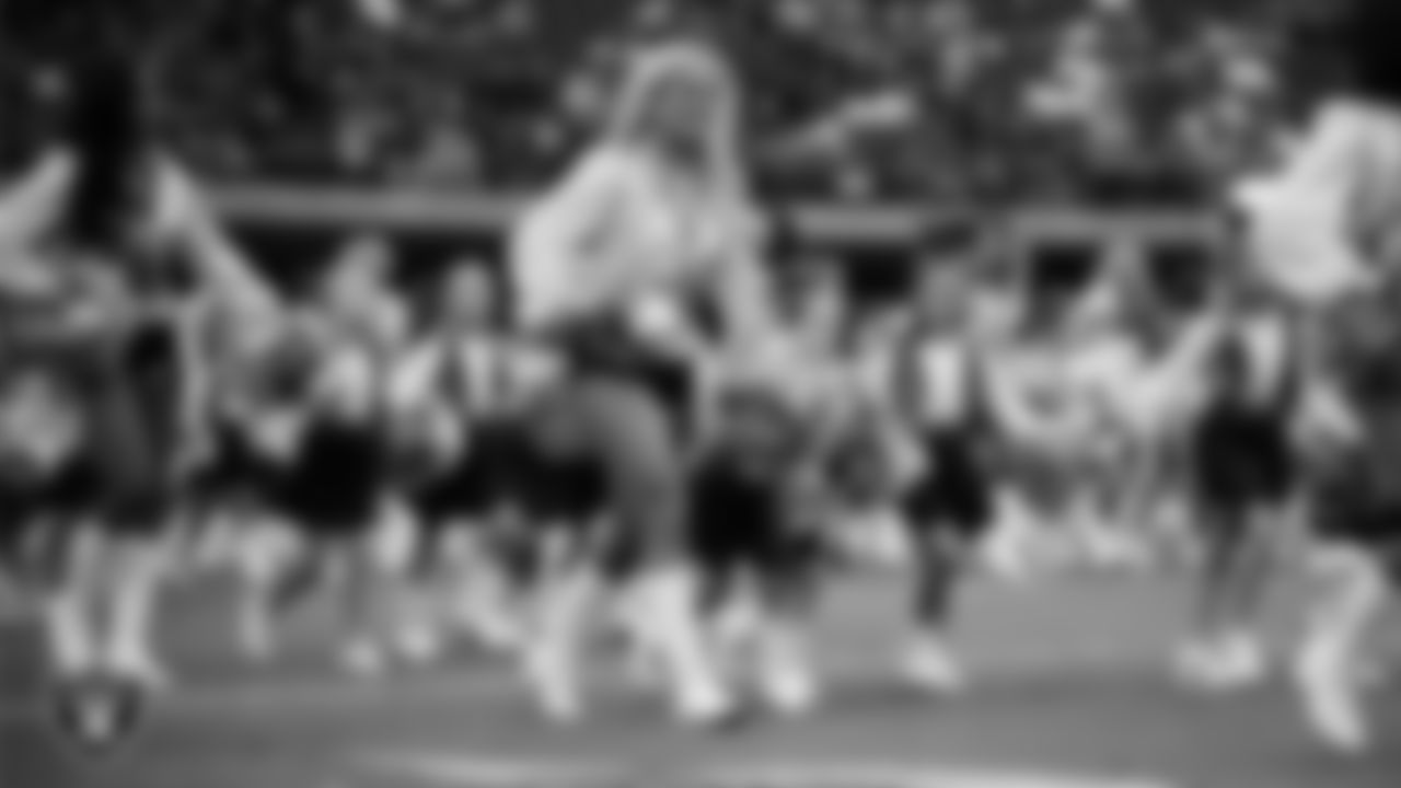 Raiderette Pip and Junior Raiderettes enter the field for their performance on the field before the preseason home game against the San Francisco 49ers at Allegiant Stadium.