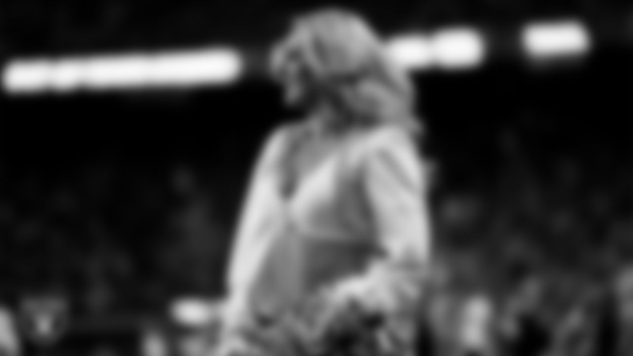 Raiderette Jessica walks onto the field for a performance during the regular season home game against the Los Angeles Chargers at Allegiant Stadium.